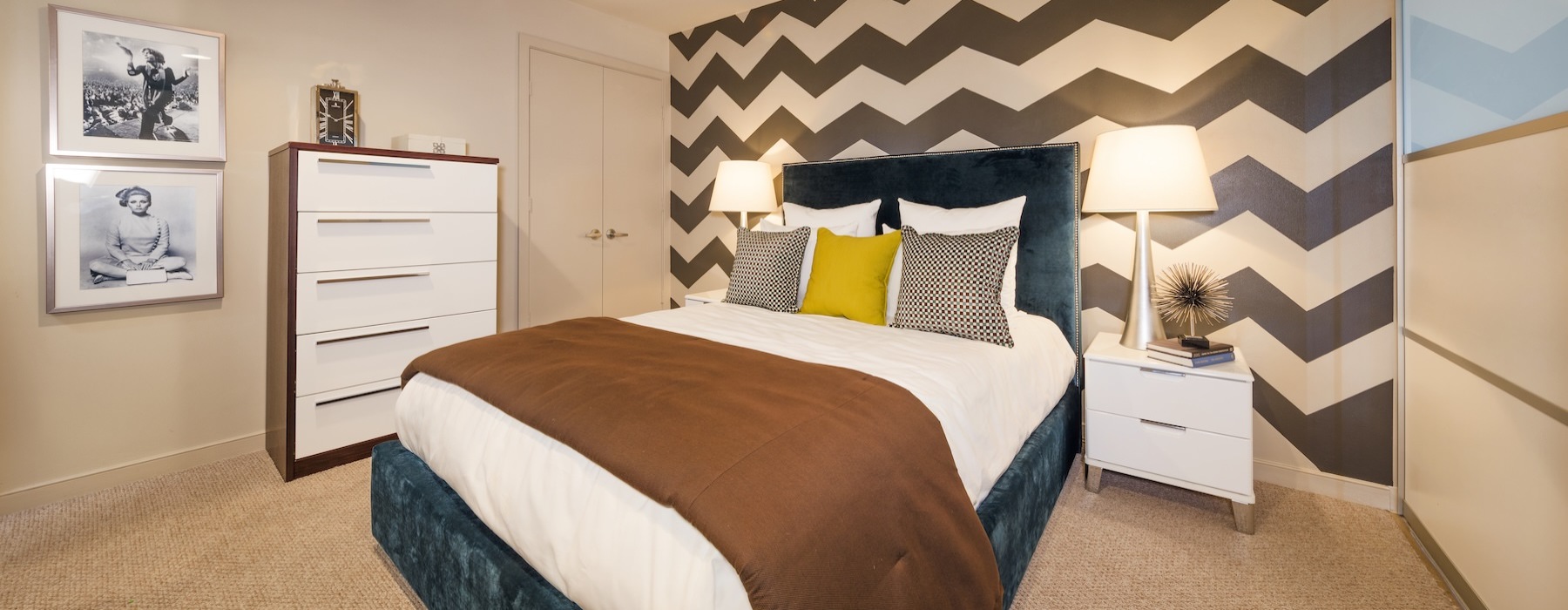 a bedroom with a bed and two nightstands