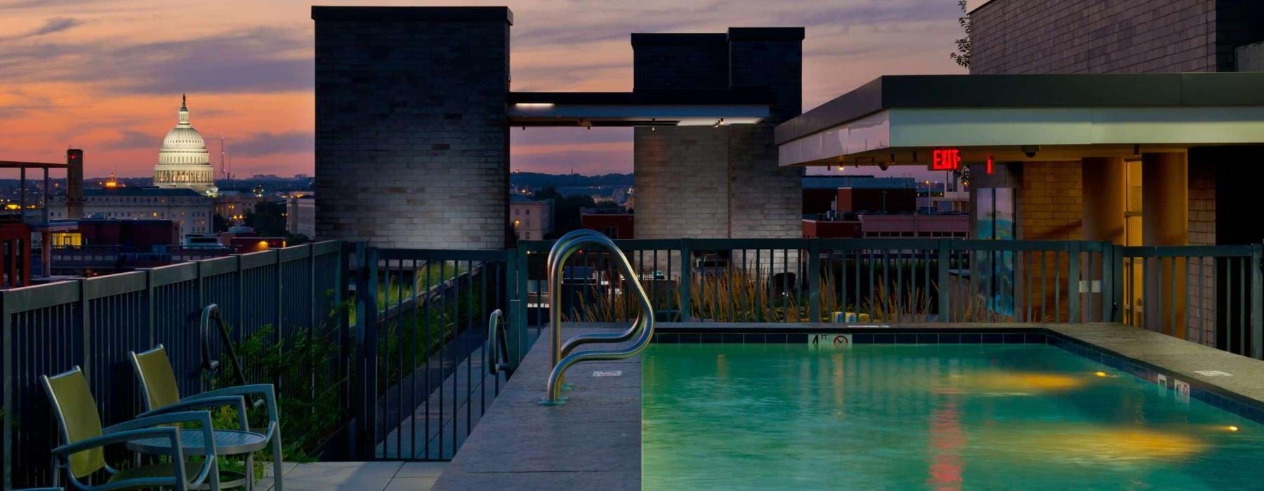 a pool with a building in the background