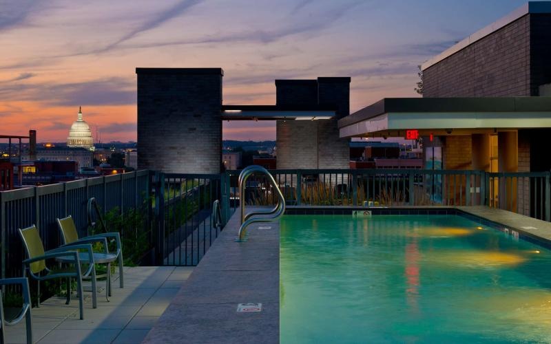 a pool with a building in the background