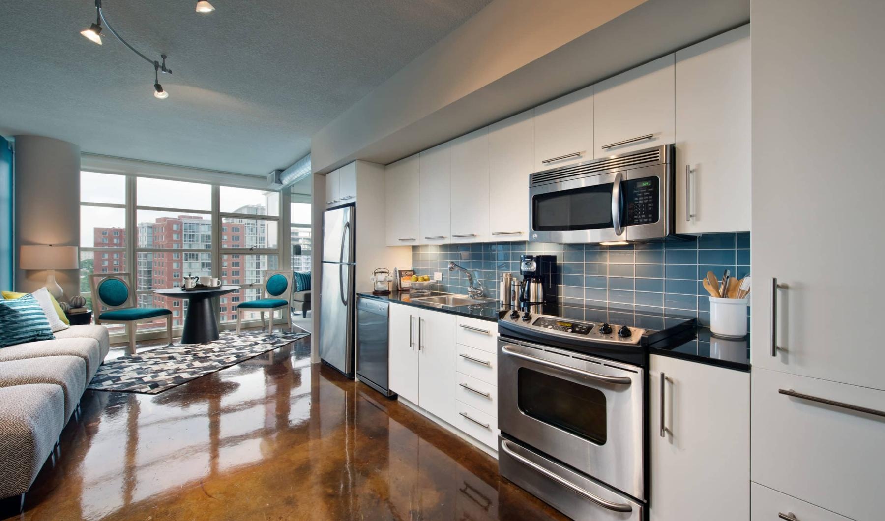 a kitchen with white cabinets