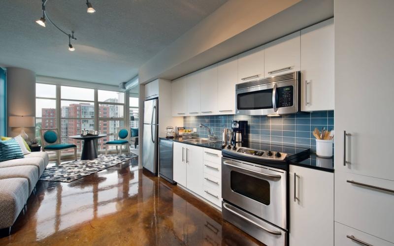 a kitchen with white cabinets