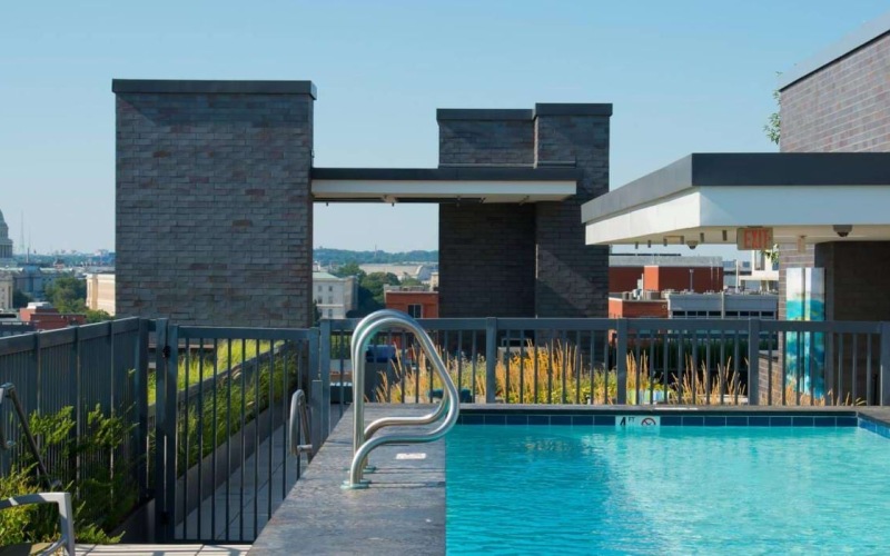 a pool with a bridge in the background