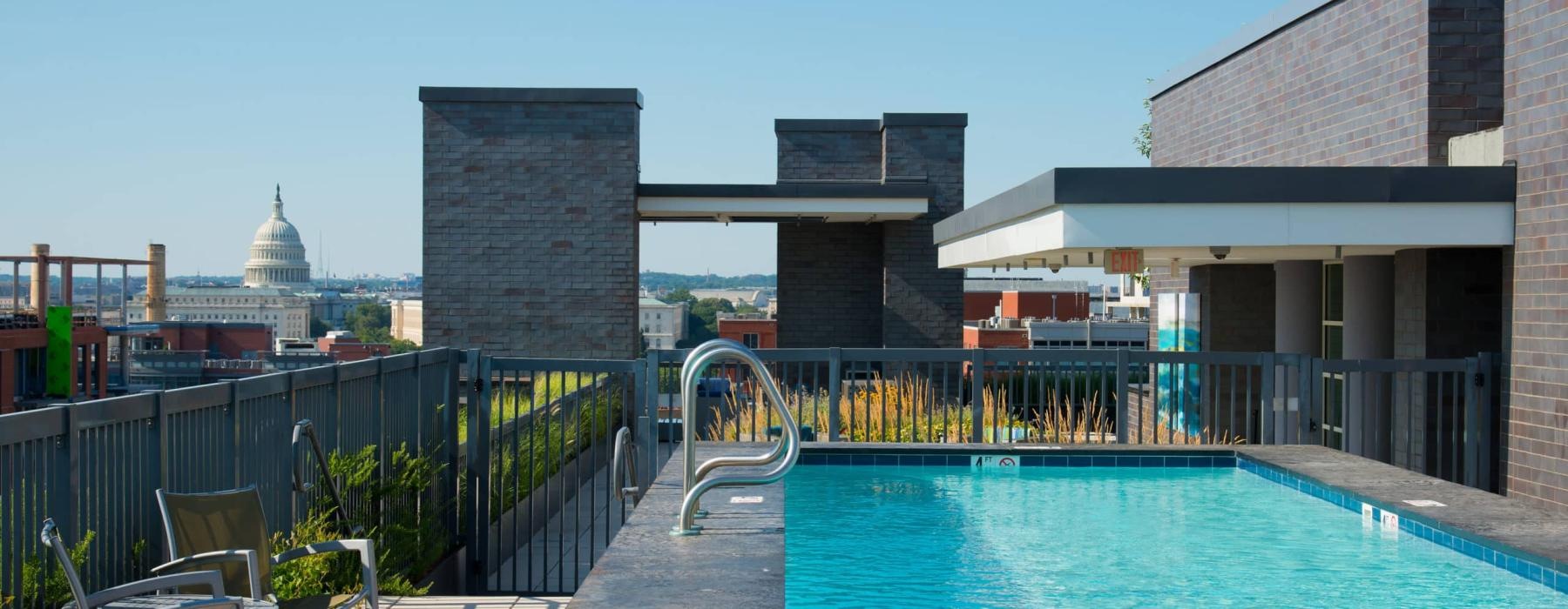 a pool with a bridge in the background